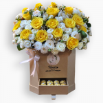 صندوق زهور باللون الابيض والاصفر مع الفيريرو روشيه